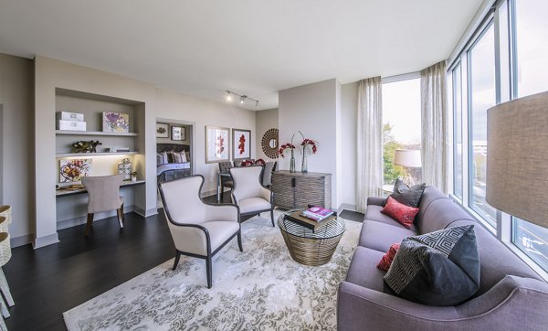 Spacious living room with modern decor at Nouvelle Apartments
