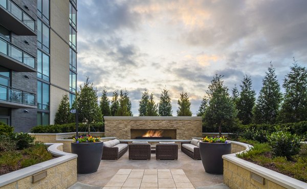 Nouvelle Apartments: Lush recreational area with green spaces and seating for relaxation