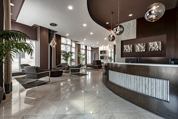 Clubhouse with modern decor and open seating at The Lofts at Park Crest Apartments