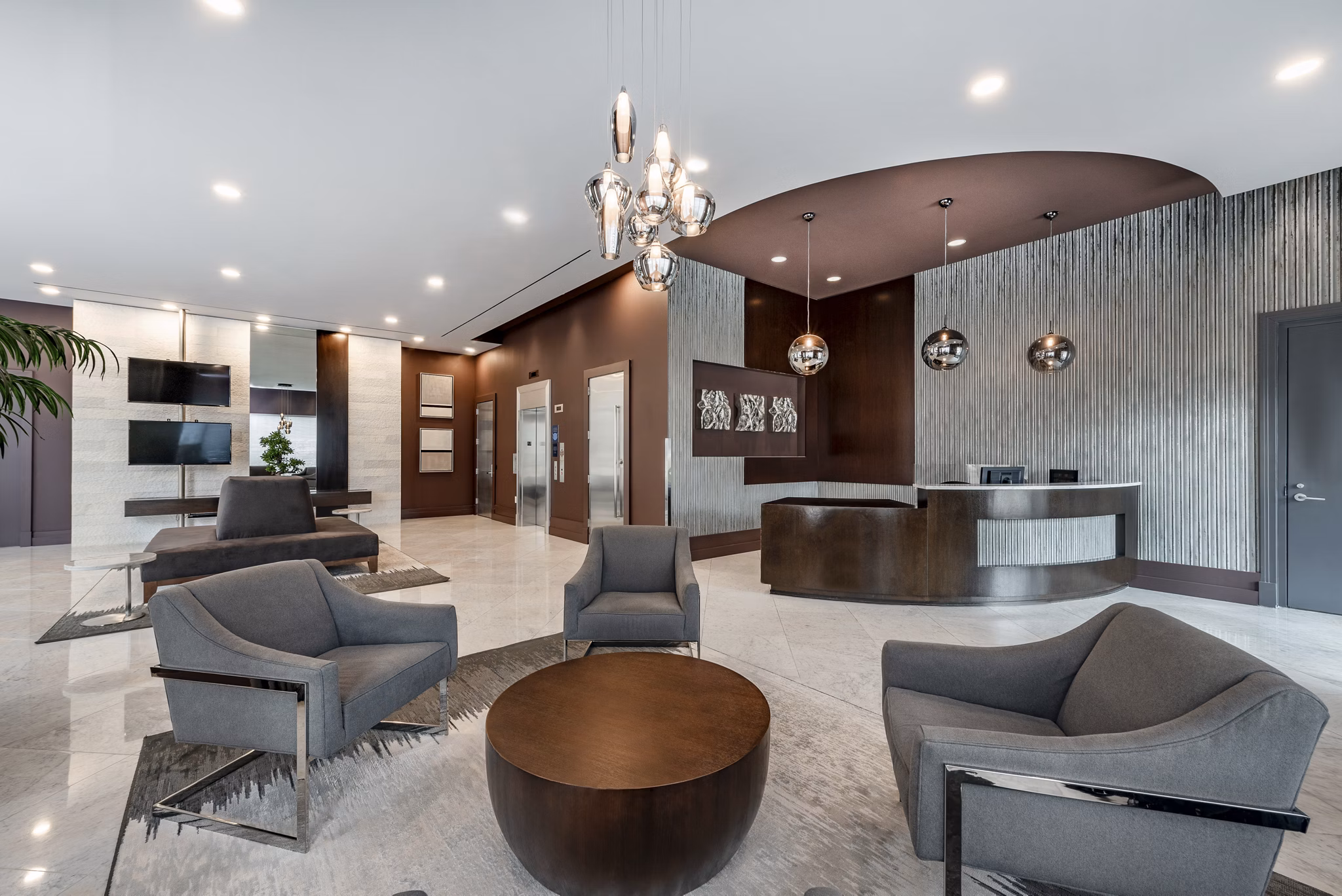 Clubhouse featuring modern decor and open seating at The Lofts at Park Crest Apartments in a luxury community setting
