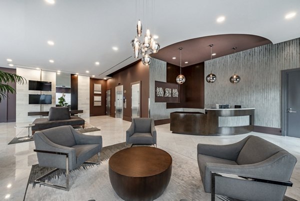 Clubhouse featuring modern decor and open seating at The Lofts at Park Crest Apartments in a luxury community setting