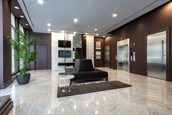 Clubhouse with modern design and ample seating at The Lofts at Park Crest Apartments