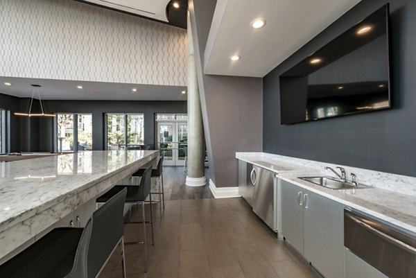 Clubhouse with modern seating and entertainment space at The Lofts at Park Crest Apartments, offering luxury living in a vibrant community