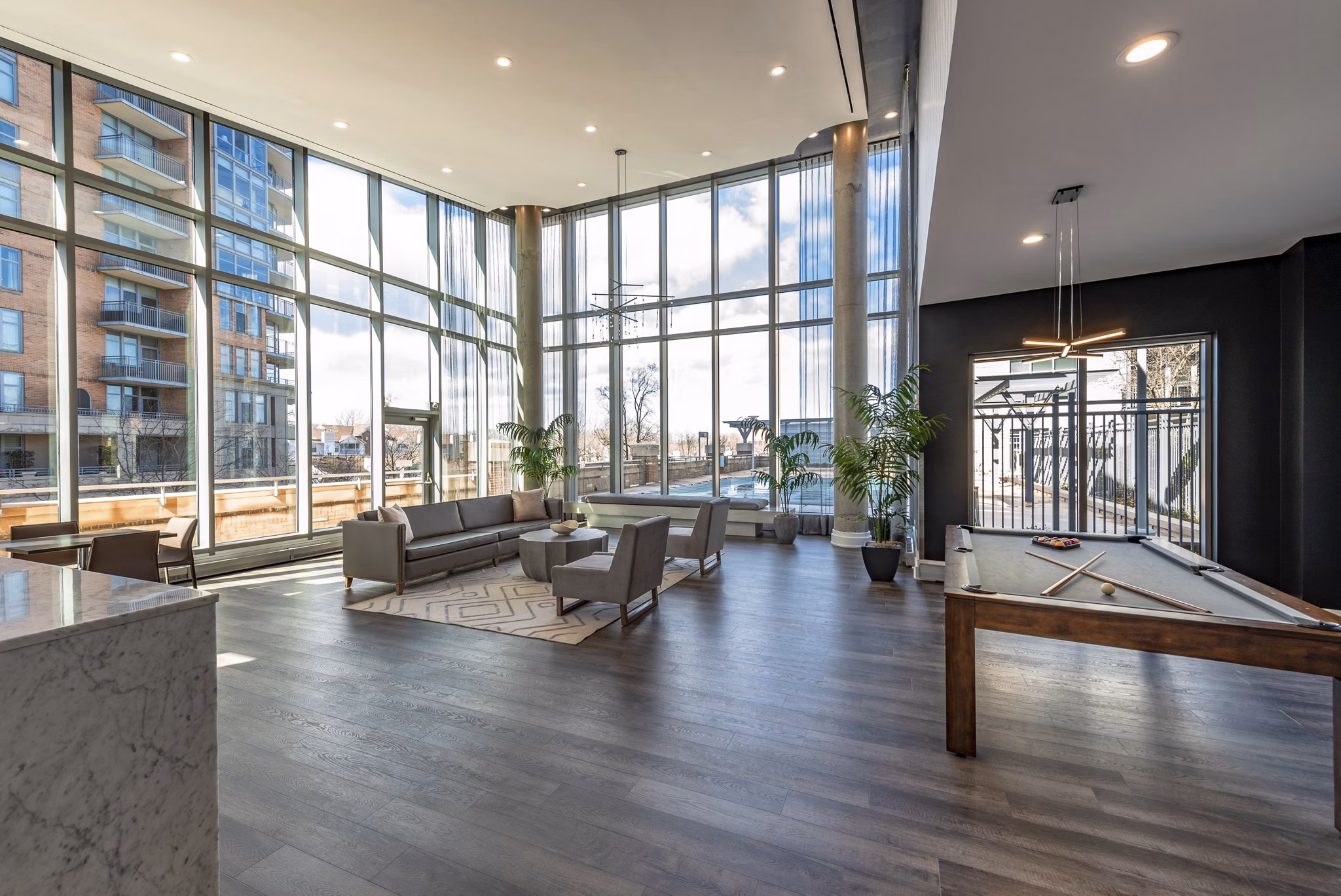 Clubhouse with modern furnishings and social spaces at The Lofts at Park Crest Apartments