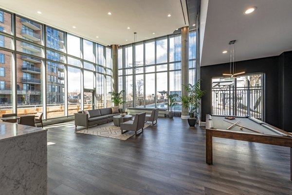 Clubhouse with modern furnishings and social spaces at The Lofts at Park Crest Apartments