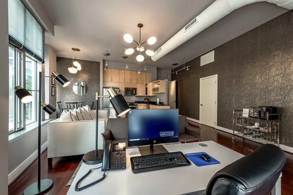 Clubhouse interior with modern design and plush seating at The Lofts at Park Crest Apartments
