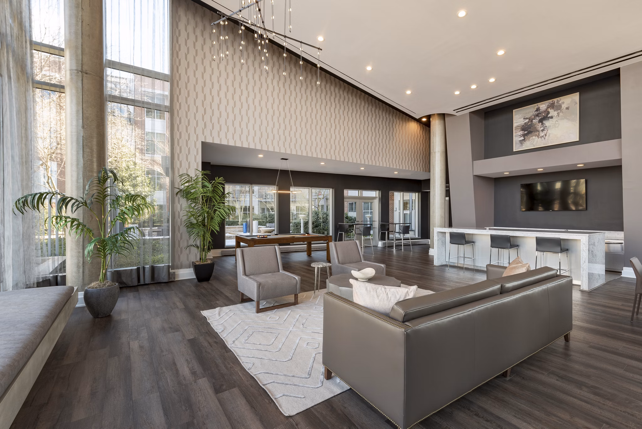 Clubhouse with modern design and spacious seating area at The Lofts at Park Crest Apartments
