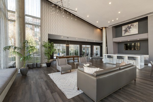 Clubhouse with modern design and spacious seating area at The Lofts at Park Crest Apartments