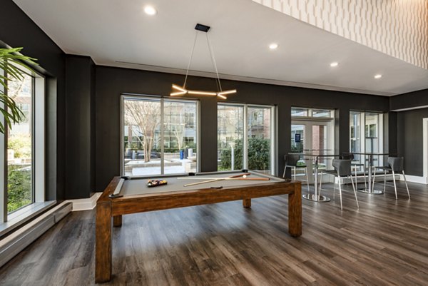 Clubhouse featuring modern design and cozy seating at The Lofts at Park Crest Apartments