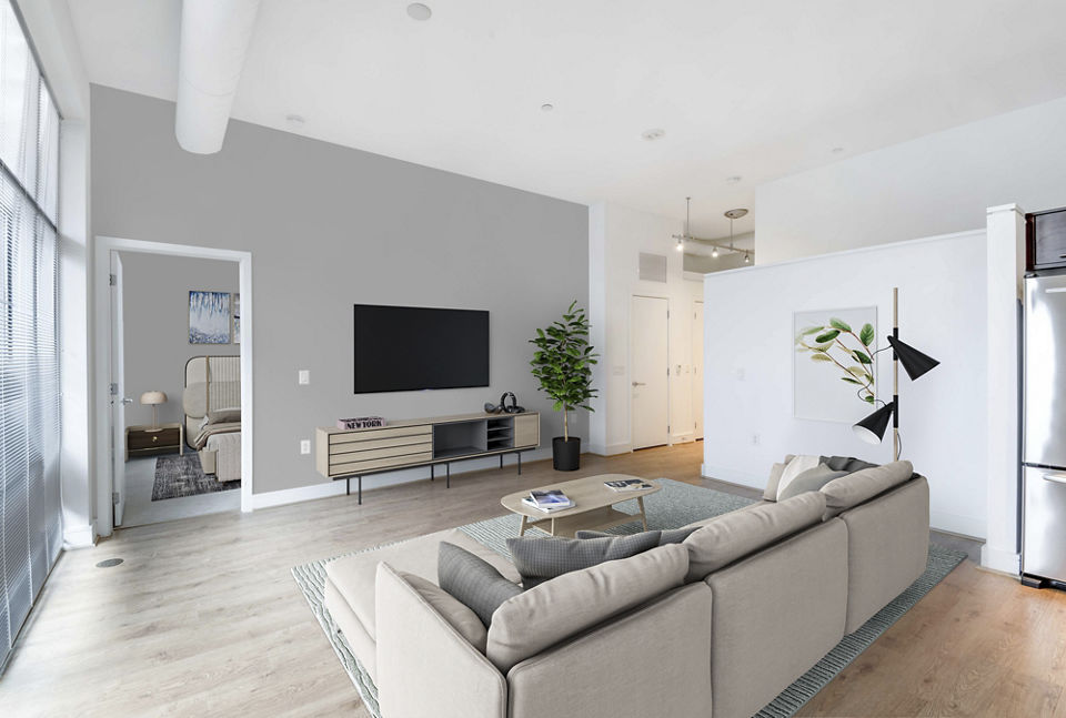 Chic living room with sleek design and large windows at The Lofts at Park Crest Apartments