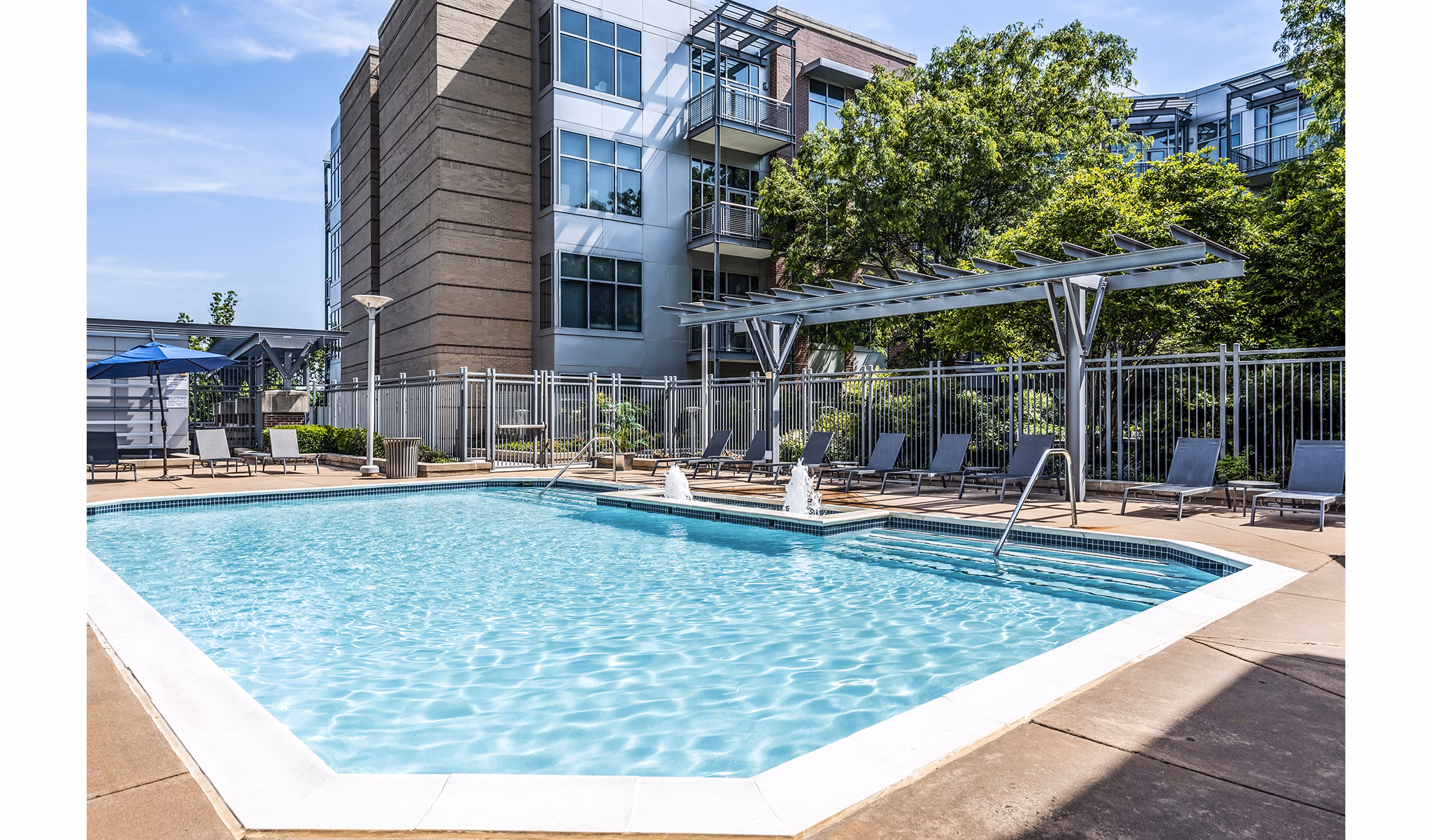 Inviting swimming pool at The Lofts at Park Crest Apartments, perfect for relaxation and outdoor fun