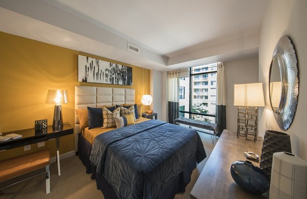 Elegant bedroom with modern furnishings at Latitude Apartments luxury rentals