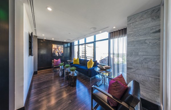 Modern clubhouse with stylish seating and bright decor at Latitude Apartments for social gatherings and events