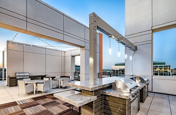 Modern rooftop grill station with panoramic city views at Latitude Apartments