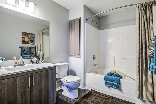 Bathroom featuring sleek fixtures and modern design at Acacia on Santa Rosa Creek Apartments
