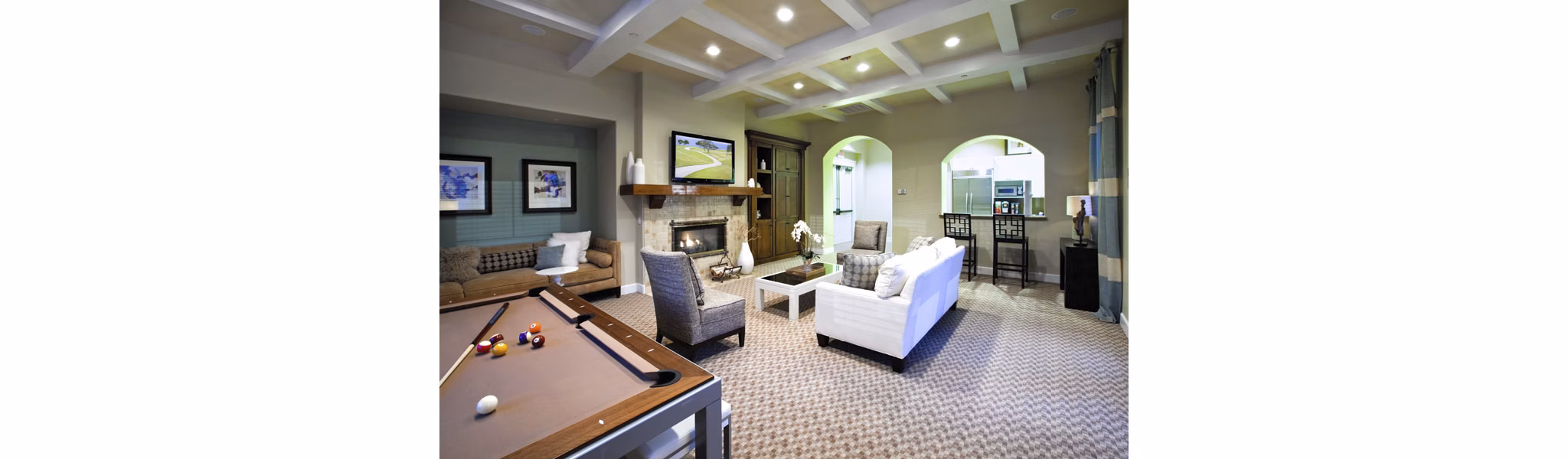 Clubhouse with modern furnishings and cozy seating at Acacia on Santa Rosa Creek Apartments