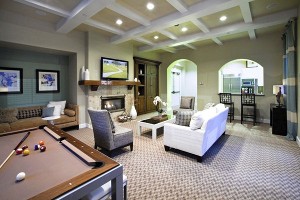 Clubhouse with modern furnishings and cozy seating at Acacia on Santa Rosa Creek Apartments