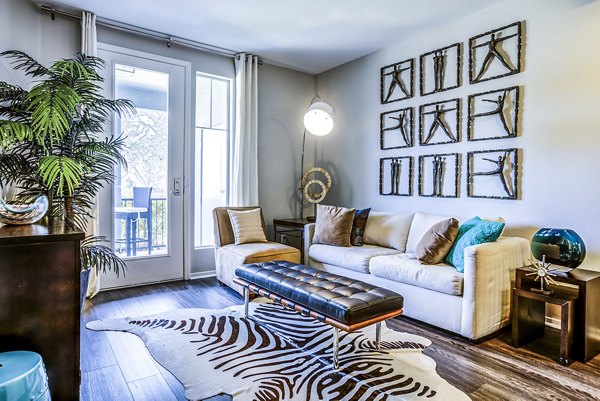 Living room with modern decor and natural light at Acacia on Santa Rosa Creek Apartments
