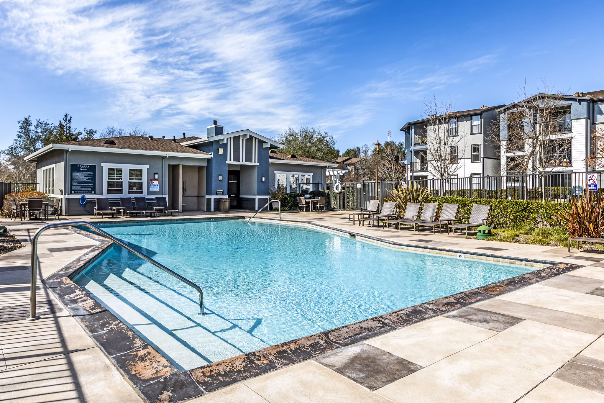 Resort-style pool with sundeck at Acacia on Santa Rosa Creek Apartments, ideal for relaxation and leisure