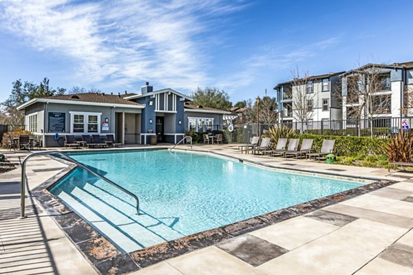 Resort-style pool with sundeck at Acacia on Santa Rosa Creek Apartments, ideal for relaxation and leisure