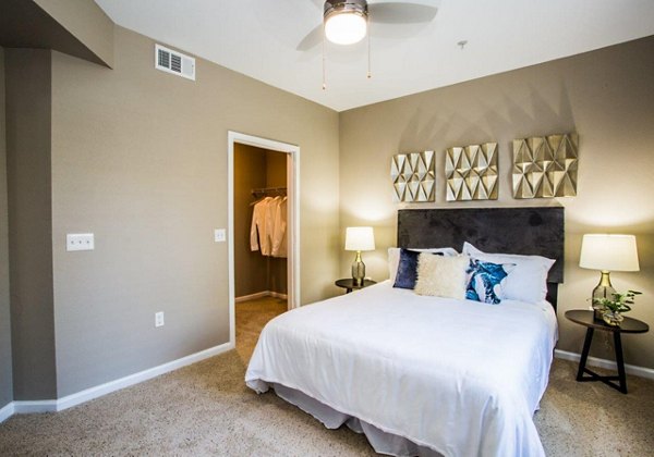 Spacious bedroom featuring modern design elements in Glo Las Vegas Apartments