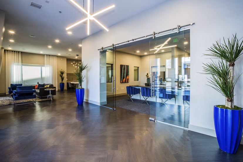 Clubhouse with modern design and cozy seating at Glo Las Vegas Apartments, ideal for luxury living experiences