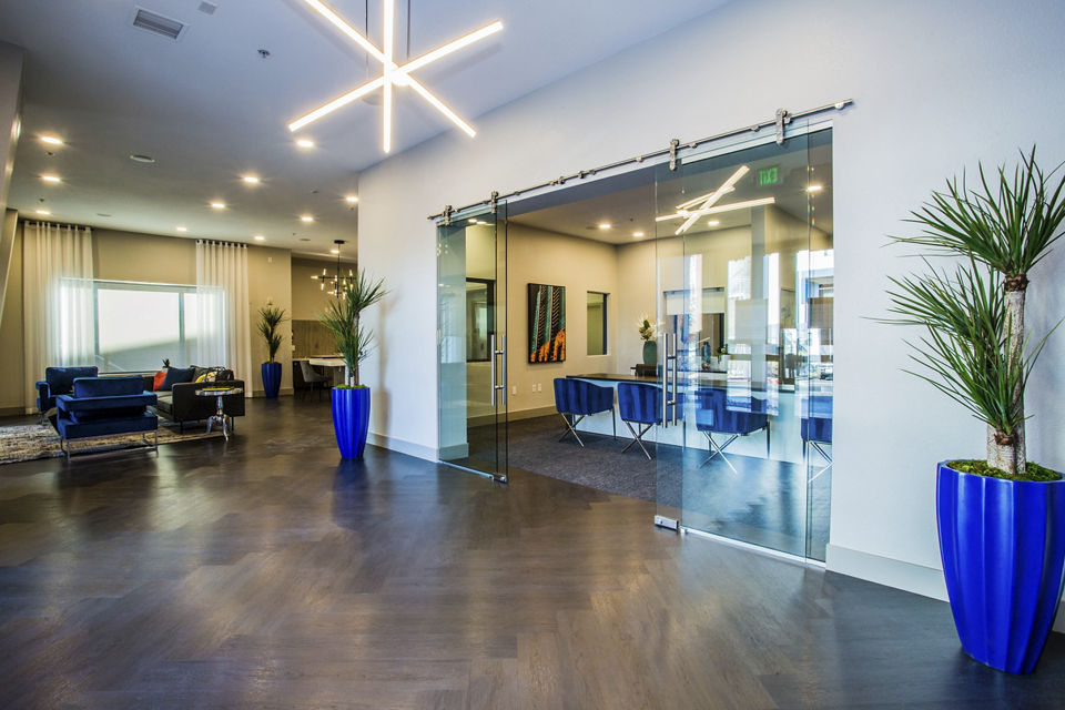 Clubhouse with modern design and cozy seating at Glo Las Vegas Apartments, ideal for luxury living experiences