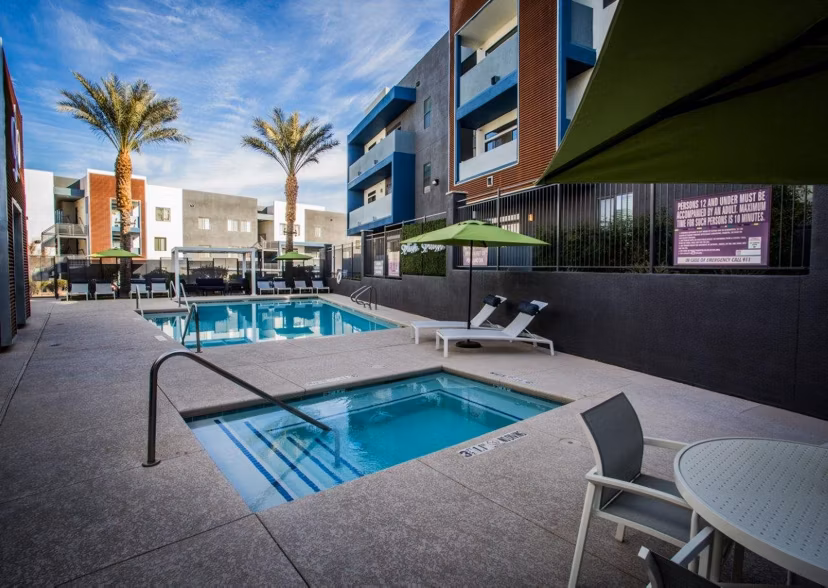 Relaxing hot tub with pristine water at Glo Las Vegas Apartments, ideal for unwinding in luxury