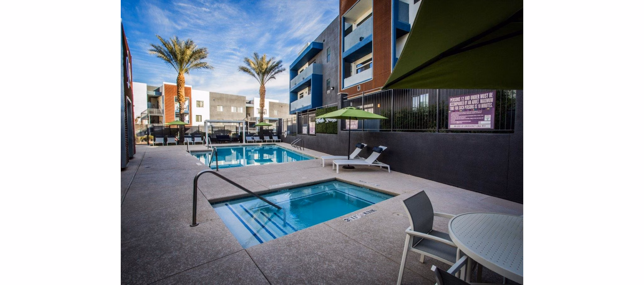 Relaxing hot tub with pristine water at Glo Las Vegas Apartments, ideal for unwinding in luxury
