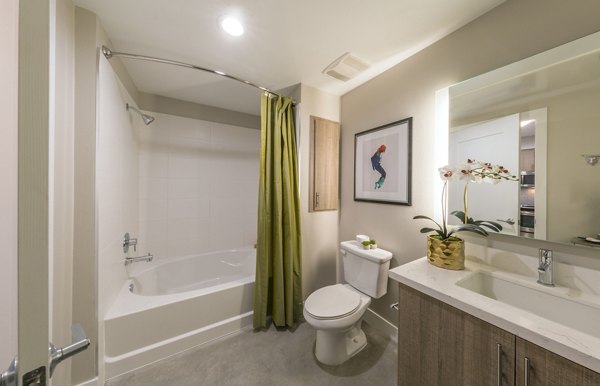 Bathroom featuring sleek fixtures and marble countertops at The Desmond Apartments in luxury Greystar living