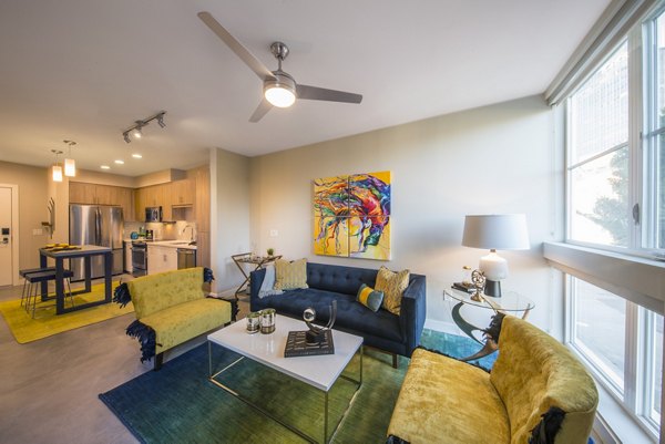 Spacious living room with modern decor in The Desmond Apartments luxury community