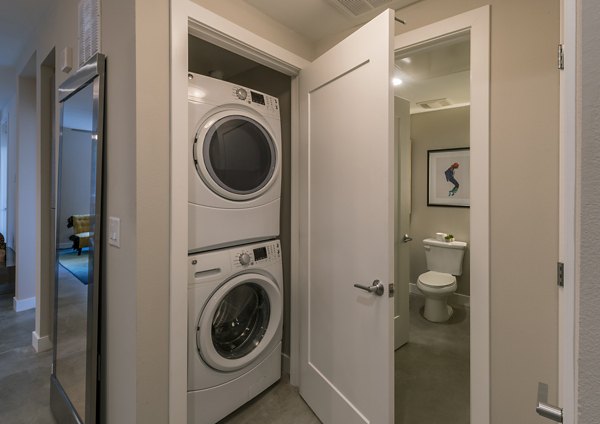Laundry room with modern appliances at The Desmond Apartments in Los Angeles