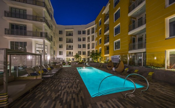 Poolside leisure area at The Desmond Apartments featuring luxury seating and modern design