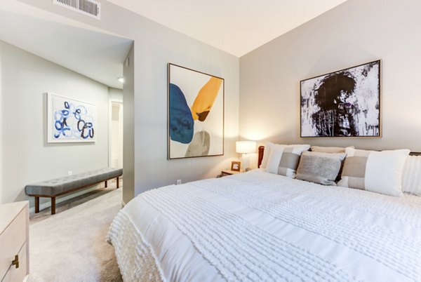 Cozy bedroom with modern design at The Gallery at NoHo Commons Apartments
