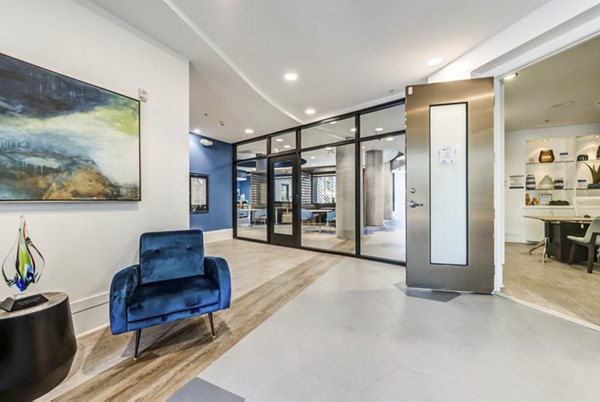 Clubhouse with modern design and seating areas at The Gallery at NoHo Commons Apartments Perfect for social gatherings and community events