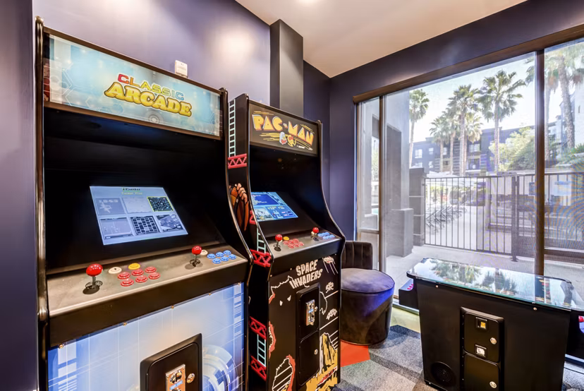 Game room with pool table and arcade games at The Gallery at NoHo Commons Apartments, Los Angeles Enjoy entertainment amenities in luxury apartments