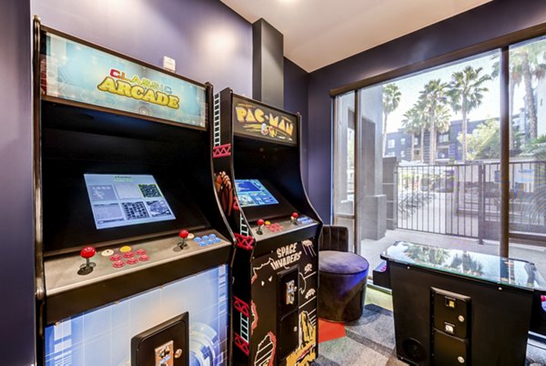 Game room with pool table and arcade games at The Gallery at NoHo Commons Apartments, Los Angeles Enjoy entertainment amenities in luxury apartments