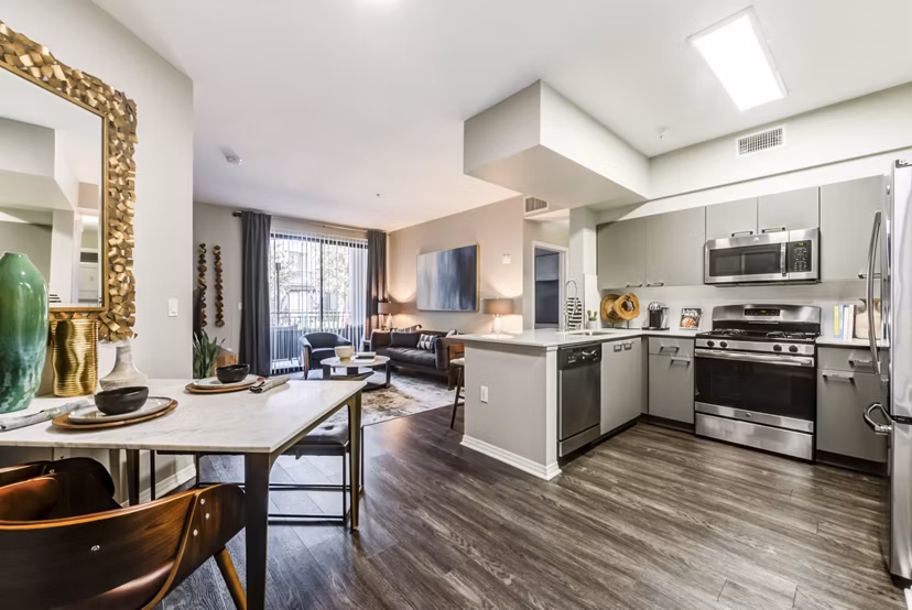 Dining area with stylish decor and hardwood floors at The Gallery at NoHo Commons Apartments