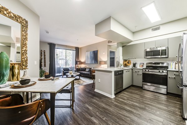Dining area with stylish decor and hardwood floors at The Gallery at NoHo Commons Apartments