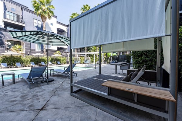 Large outdoor pool area at The Gallery at NoHo Commons Apartments, perfect for relaxation and social gatherings in a luxurious setting