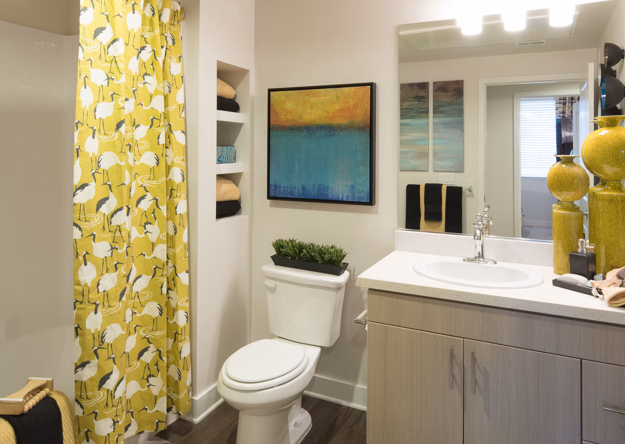Modern bathroom featuring sleek fixtures and glass shower at The Verge Apartments