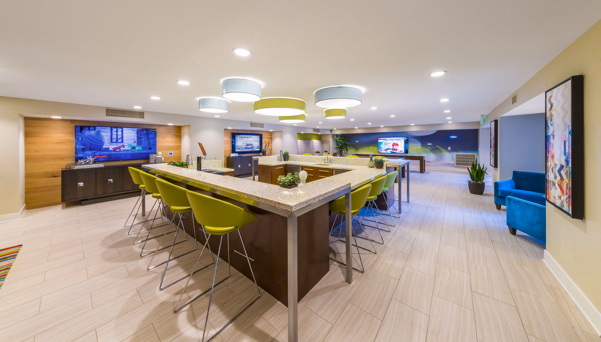 Clubhouse with modern design and cozy seating areas at The Verge Apartments, a Greystar luxury community