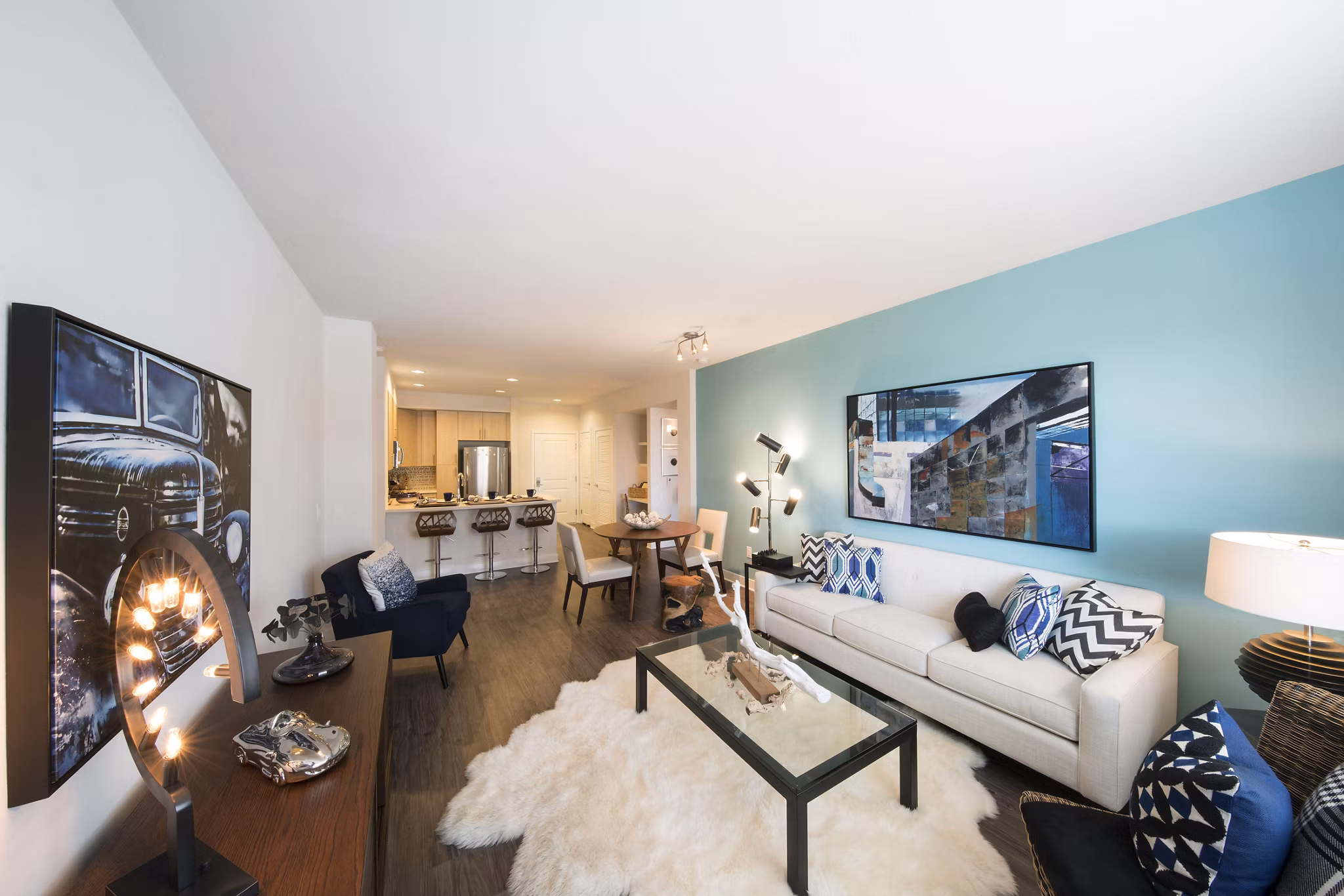 Spacious living room with modern decor at The Verge Apartments, showcasing luxury urban living