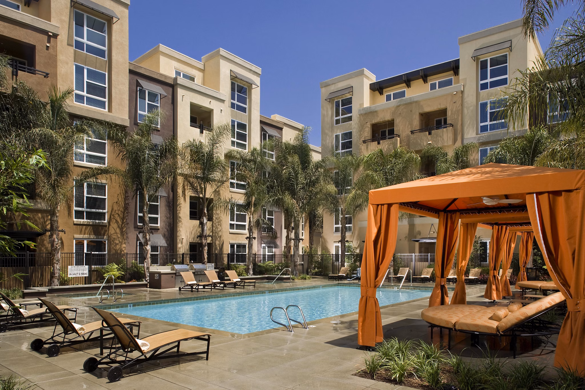 Rooftop pool at Calypso Apartments and Lofts offering luxury relaxation and scenic views in urban setting