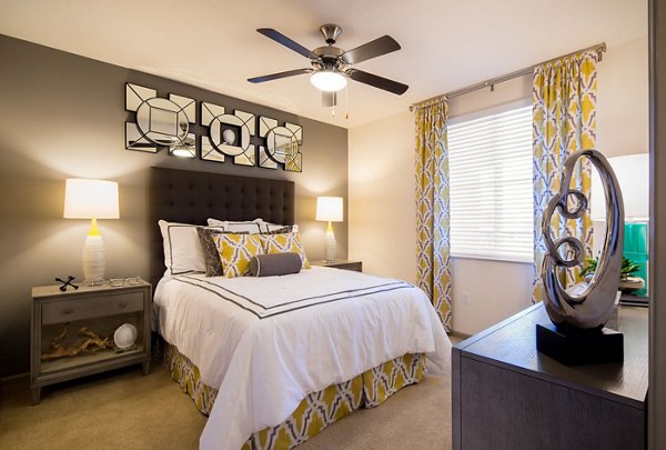 Cozy bedroom with modern decor at Blue Sol Apartments