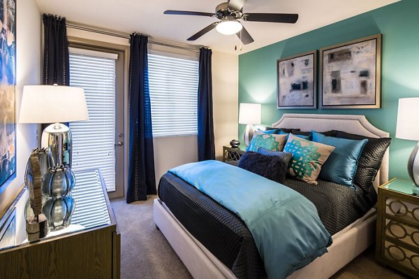 Cozy bedroom with stylish decor at Blue Sol Apartments, Greystar luxury community
