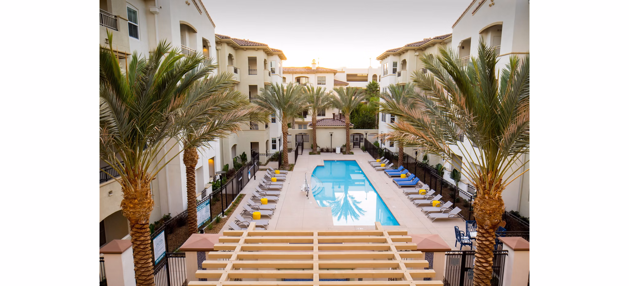 Relaxing outdoor pool with lounge chairs at Blue Sol Apartments, luxury living in Greystar's exclusive community