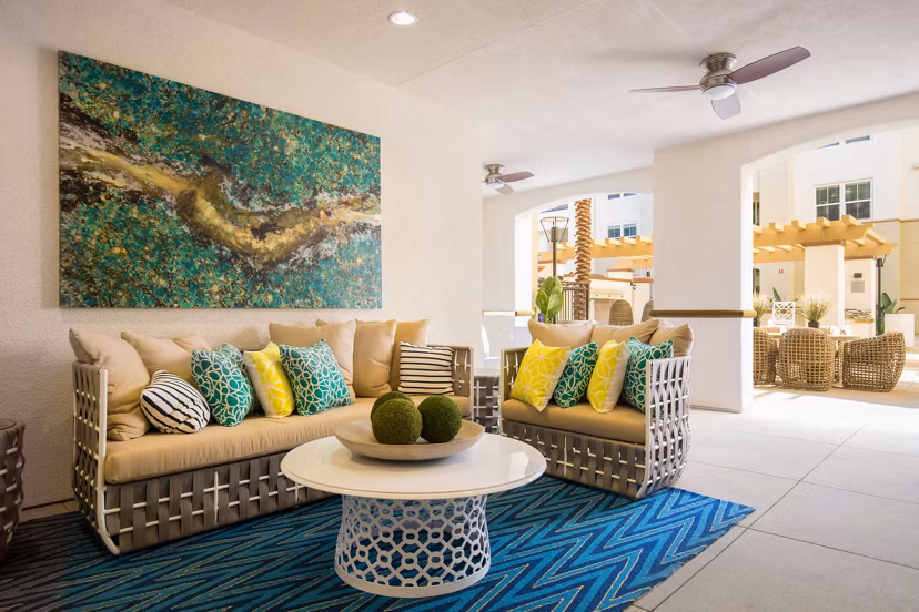 Vibrant recreational area with modern seating and greenery at Blue Sol Apartments