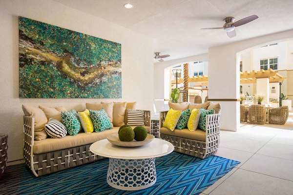Vibrant recreational area with modern seating and greenery at Blue Sol Apartments