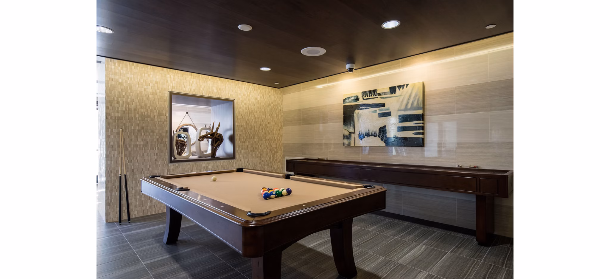 Modern recreational area with outdoor seating and greenery at Blue Sol Apartments, perfect for relaxation and social gatherings